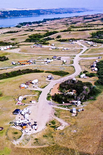 High-angle view of a rural campground near a lake.